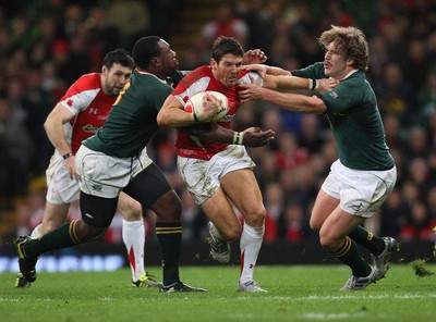 13.11.10 .. Wales v South Africa. -  Wales' James Hook breaks between South Africa's Francois Steyn and Tendai Mtawarira  