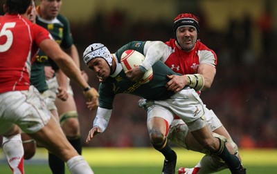 13.11.10 .. Wales v South Africa. -  South Africa's Gio Aplon is tackled by Wales' Jonathan Thomas  