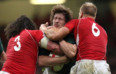 13.11.10 .. Wales v South Africa. -  South Africa's Francois Steyn is stopped by Wales' Andy Powell and Adam Jones  