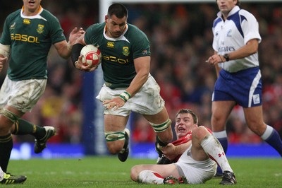 13.11.10 .. Wales v South Africa. -  South Africa's Pierre Spies is tackled by Wales' Adam Jones  