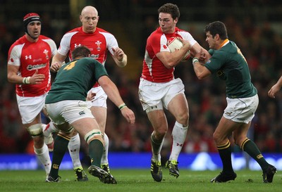 13.11.10 .. Wales v South Africa. -  Wales' George North takes on South Africa's Morne Steyn and South Africa's Bakkies Botha  