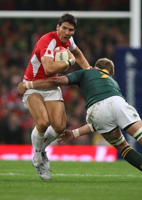 13.11.10 .. Wales v South Africa. -  Wales' James Hook takes on South Africa's Juan Smith  