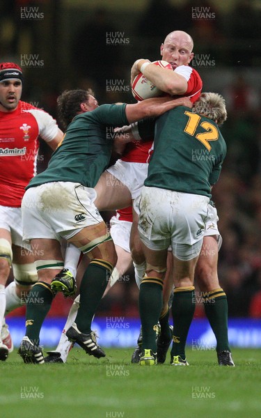 13.11.10 .. Wales v South Africa. -  Wales' Tom Shanklin is tackled by South Africa's Jean De Villiers and Deon Stegmann  