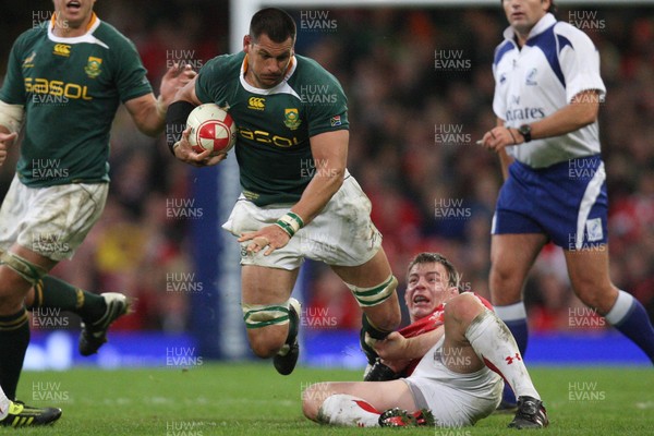 13.11.10 .. Wales v South Africa. -  South Africa's Pierre Spies is tackled by Wales' Adam Jones  