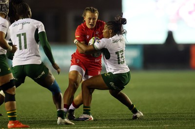 180926 - Wales Women v South Africa Women - Vodafone Wales WXV Series - Lleucu George of Wales is tackled by Maceala Samboya of South Africa 