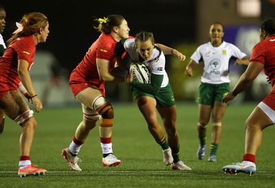 180926 - Wales Women v South Africa Women - Vodafone Wales WXV Series - Libbie Janse Van Rensburg of South Africa is tackled by Gwen Crabb of Wales 