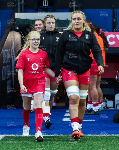 190926 Wales v South Africa, Vodafone Wales WXV Series - Wales co-captain Alex Callender walks out with match mascot Lola Snowdon