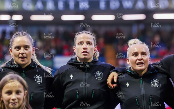 190926 Wales v South Africa, Vodafone Wales WXV Series - Freya Bell of Wales, Amy Williams of Wales and Seren Singleton of Wales of Wales during the anthems