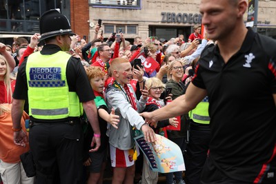 190823 - Wales v South Africa - Vodafone Summer Series - Fans watch as the Wales team walk into the stadium