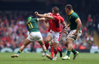 190823 - Wales v South Africa - Vodafone Summer Series - Tom Rogers of Wales is tackled by Cheslin Kolbe of South Africa 