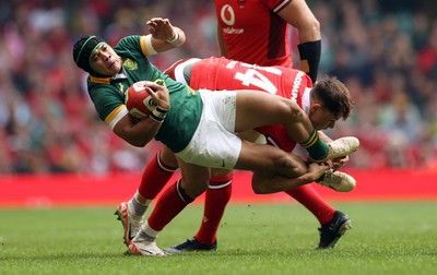 190823 - Wales v South Africa - Vodafone Summer Series - Cheslin Kolbe of South Africa is tackled by Tom Rogers of Wales 