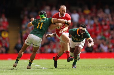 190823 - Wales v South Africa - Vodafone Summer Series - Cai Evans of Wales is tackled by Cheslin Kolbe and Siya Kolisi of South Africa 