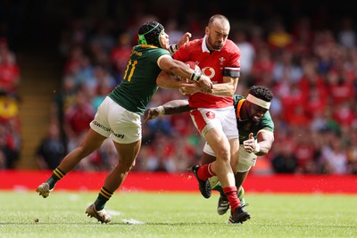 190823 - Wales v South Africa - Vodafone Summer Series - Cai Evans of Wales is tackled by Cheslin Kolbe and Siya Kolisi of South Africa 