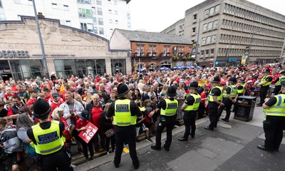 190823 - Wales v South Africa, Summer Nations Series 2023 - Fans gather outside the Parkgate Hotel as the they wait for the team to walk from the Parkgate Hotel to the Principality Stadium