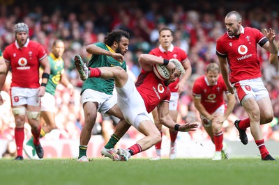 190823 - Wales v South Africa, Summer Nations Series 2023 - Johnny Williams of Wales is tackled by Jaden Hendrikse of South Africa