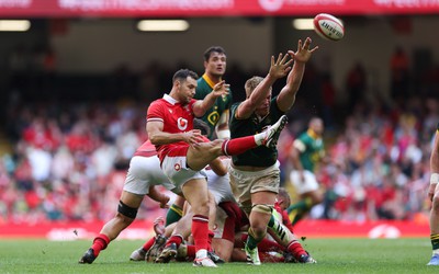 190823 - Wales v South Africa, Summer Nations Series 2023 - Pieter-Steph du Toit of South Africa closes in on Tomos Williams of Wales