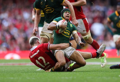 190823 - Wales v South Africa, Summer Nations Series 2023 - Cheslin Kolbe of South Africa is tackled by Johnny Williams of Wales