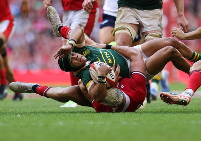 190823 - Wales v South Africa, Summer Nations Series 2023 - Cheslin Kolbe of South Africa is tackled by Johnny Williams of Wales