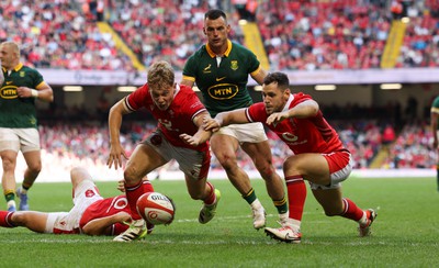 190823 - Wales v South Africa, Summer Nations Series 2023 - Sam Costelow of Wales and Tomos Williams of Wales dive on the loose ball to prevent a South Africa try