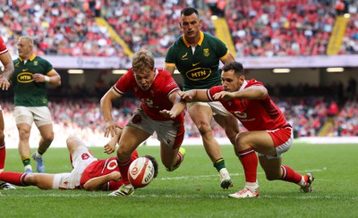 190823 - Wales v South Africa, Summer Nations Series 2023 - Sam Costelow of Wales and Tomos Williams of Wales dive on the loose ball to prevent a South Africa try