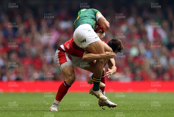 190823 - Wales v South Africa - Vodafone Summer Series - Cheslin Kolbe of South Africa is tackled by Tom Rogers of Wales 