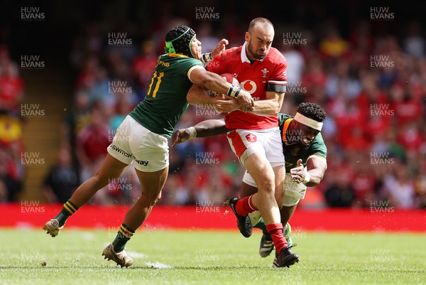 190823 - Wales v South Africa - Vodafone Summer Series - Cai Evans of Wales is tackled by Cheslin Kolbe and Siya Kolisi of South Africa 