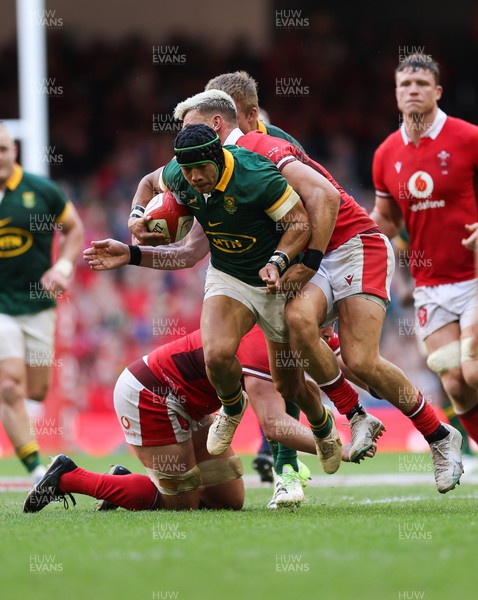 190823 - Wales v South Africa, Summer Nations Series 2023 - Cheslin Kolbe of South Africa is tackled by Johnny Williams of Wales