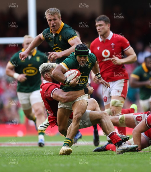 190823 - Wales v South Africa, Summer Nations Series 2023 - Cheslin Kolbe of South Africa is tackled by Johnny Williams of Wales