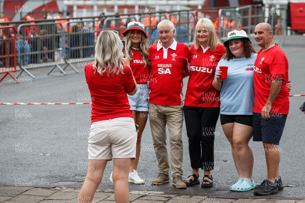 190823 - Wales v South Africa - Summer Series - Wales fans pose for a photograph outside the Principality Stadium before the match