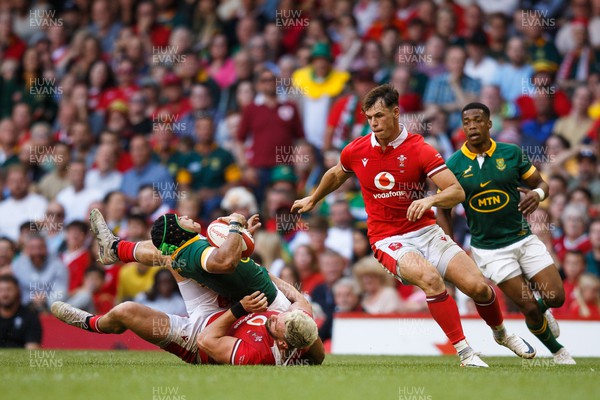190823 - Wales v South Africa - Summer Series - Johnny Williams of Wales tackles Cheslin Kolbe of South Africa