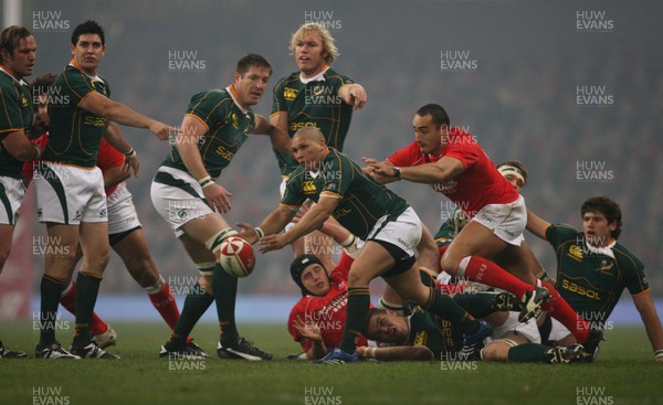 24.11.07 Wales v South Africa... South Africa's Enrico Januarie passes under pressure from Sonny Parker. 