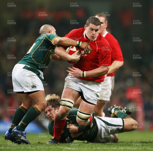 24.11.07 Wales v South Africa... Wales' Ian Evans is tackled by South Africa's Francois Steyn and Enrico Januarie 