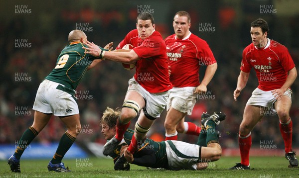 24.11.07 Wales v South Africa... Wales' Ian Evans is tackled by South Africa's Francois Steyn and Enrico Januarie 