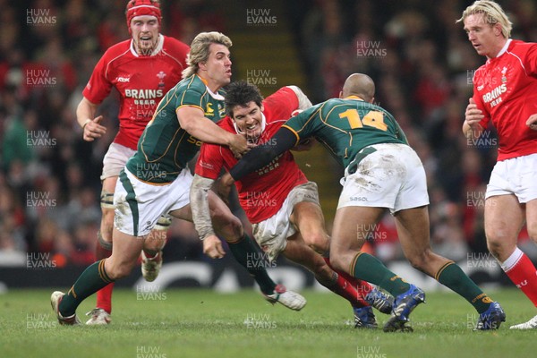 24.11.07 - Wales v South Africa, Prince William Cup. - Wales' James Hook is tackled by South Africa's Andre Pretorius and JP Pietersen Huw Evans Agency, Cardiff