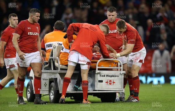 241118 - Wales v South Africa - Under Armour Series - Elliot Dee, Gareth Anscombe, Rob Evans and Liam Williams share a moment with Ellis Jenkins of Wales as he's taken off injured