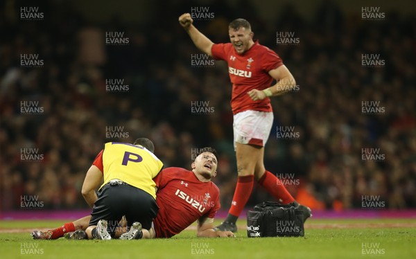 241118 - Wales v South Africa, Under Armour Series 2018 - Ellis Jenkins of Wales receives treatment for an injury as Elliot Dee of Wales celebrates the win on the final whistle