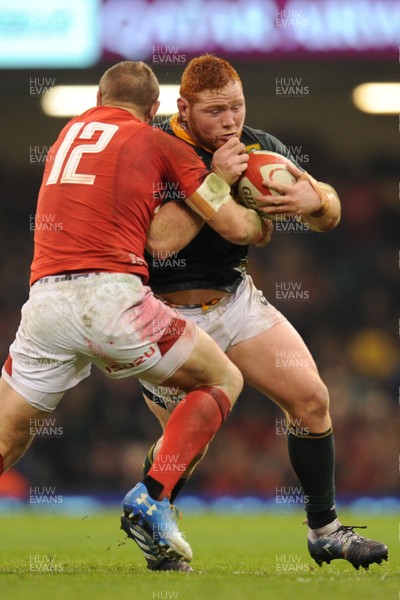 241118 - Wales v South Africa - Under Armour Series -  Steven Kitshoff of South Africa is tackled by Hadleigh Parkes of Wales 