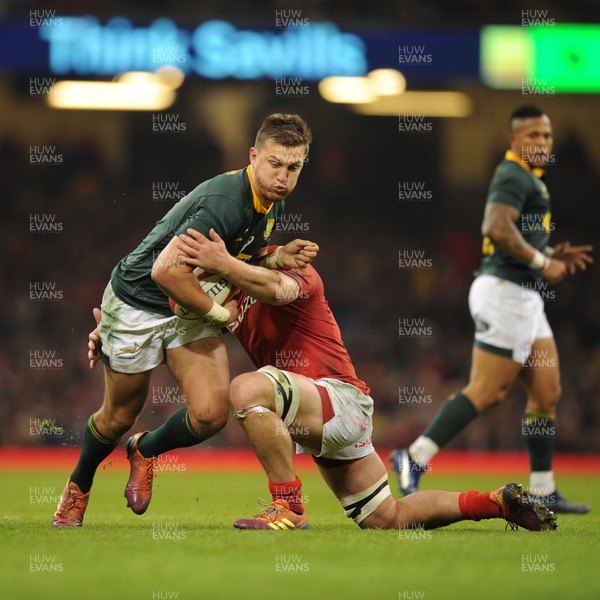 241118 - Wales v South Africa - Under Armour Series -  Handr� Pollard of South Africa is tackled by Ellis Jenkins of Wales 