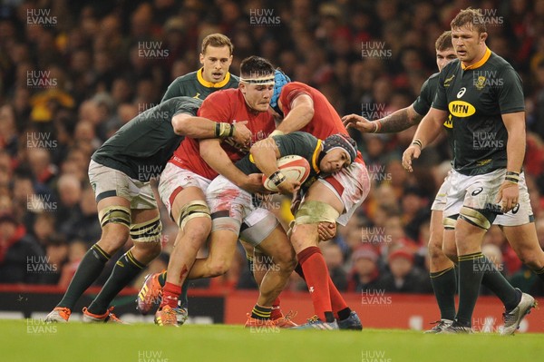 241118 - Wales v South Africa - Under Armour Series -  Cheslin Kolbe of South Africa is tackled by Ellis Jenkins of Wales 