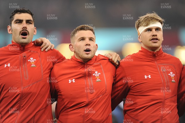 241118 - Wales v South Africa - Under Armour Series - Cory Hill of Wales, Elliot Dee of Wales and Aaron Wainwright of Wales sing the anthem