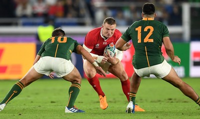 271019 - Wales v South Africa - Rugby World Cup Semi-Final - Hadleigh Parkes of Wales is tackled by Handre Pollard of South Africa