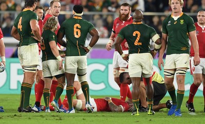 271019 - Wales v South Africa - Rugby World Cup Semi-Final - Ross Moriarty of Wales is seen to by medics after being taken out in the air