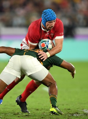 271019 - Wales v South Africa - Rugby World Cup Semi-Final - Justin Tipuric of Wales is tackled by Lukhanyo Am of South Africa