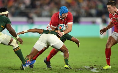 271019 - Wales v South Africa - Rugby World Cup Semi-Final - Justin Tipuric of Wales is tackled by Lukhanyo Am of South Africa