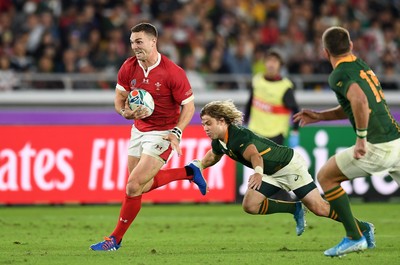 271019 - Wales v South Africa - Rugby World Cup Semi-Final - George North of Wales is tackled by Faf de Klerk of South Africa