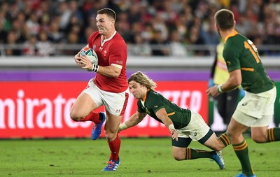 271019 - Wales v South Africa - Rugby World Cup Semi-Final - George North of Wales is tackled by Faf de Klerk of South Africa