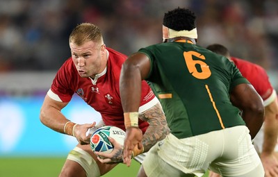 271019 - Wales v South Africa - Rugby World Cup Semi-Final - Ross Moriarty of Wales is challenged by Siya Kolisi of South Africa