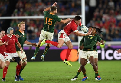 271019 - Wales v South Africa - Rugby World Cup Semi-Final - Josh Adams of Wales and Willie le Roux of South Africa clash in the air