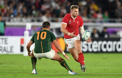 271019 - Wales v South Africa - Rugby World Cup Semi-Final - Dan Biggar of Wales is challenged by Handre Pollard of South Africa