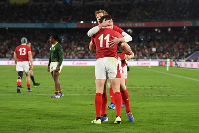 271019 - Wales v South Africa - Rugby World Cup Semi-Final - Josh Adams of Wales celebrates scoring a try with Rhys Patchell